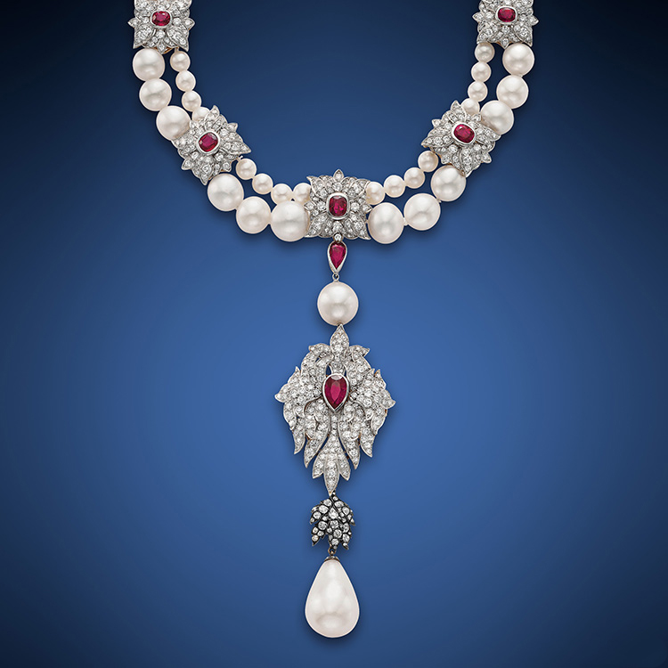 Cartier set Elizabeth Taylor’s historic 50.56 ct La Peregrina pearl as part of the pendant to this two-strand pearl, ruby and diamond necklace.
